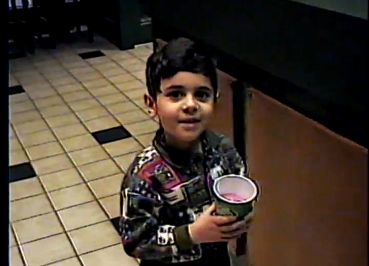 Muaz as a young boy at Gloria Jean’s on Wacker Drive