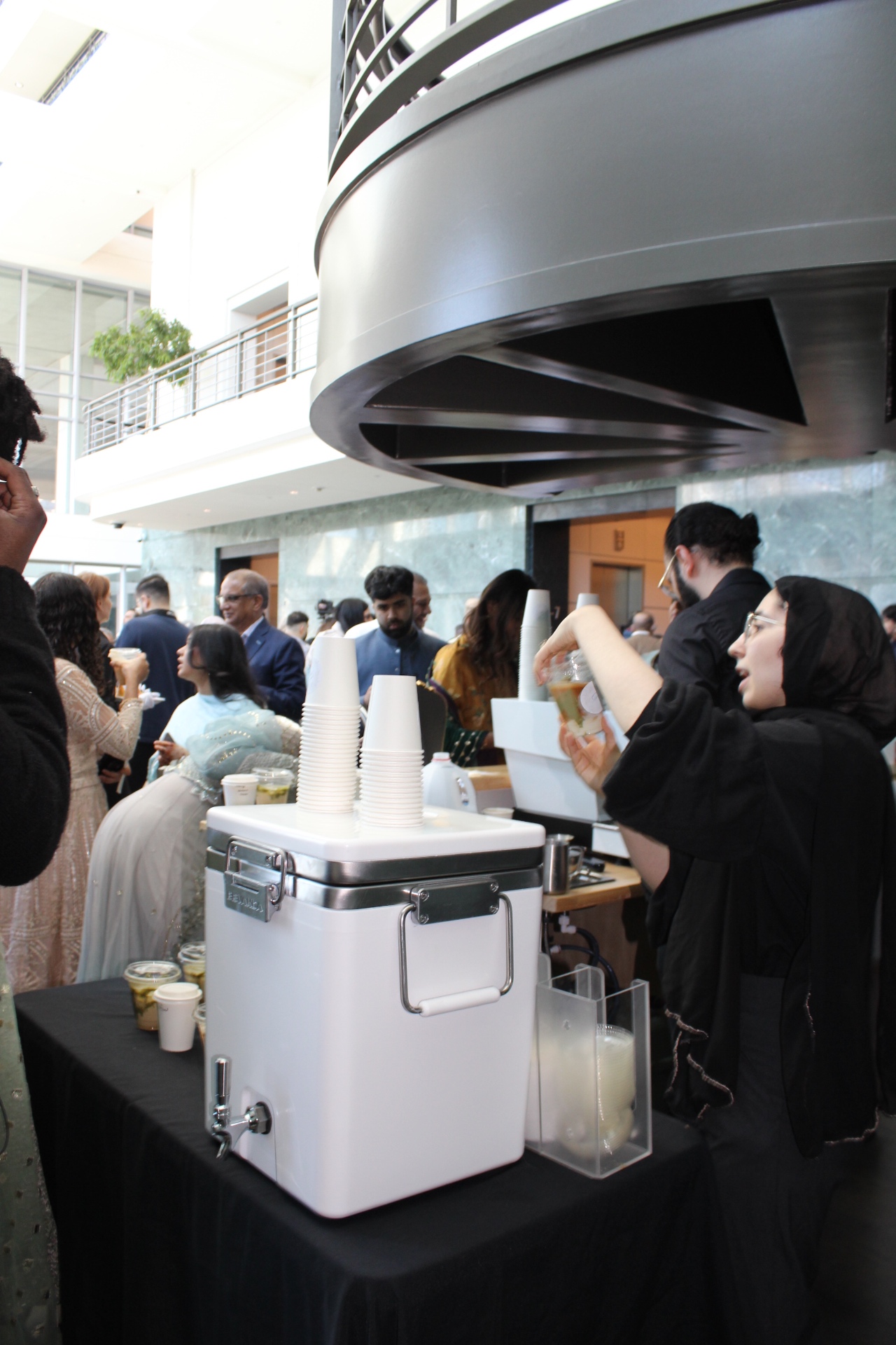 Guests gathered at a Chicago atrium event served by Citrus & Olive